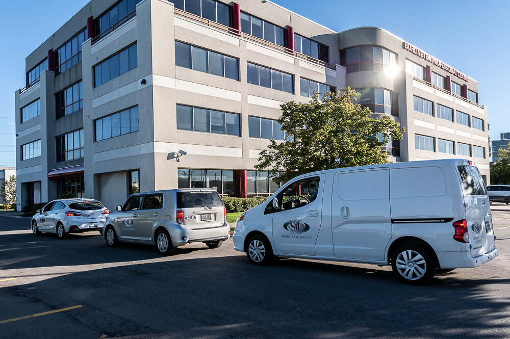 Work Vehicles parked in front of Clinic building